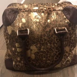 Cowhide animal print with gold splashed of paint!